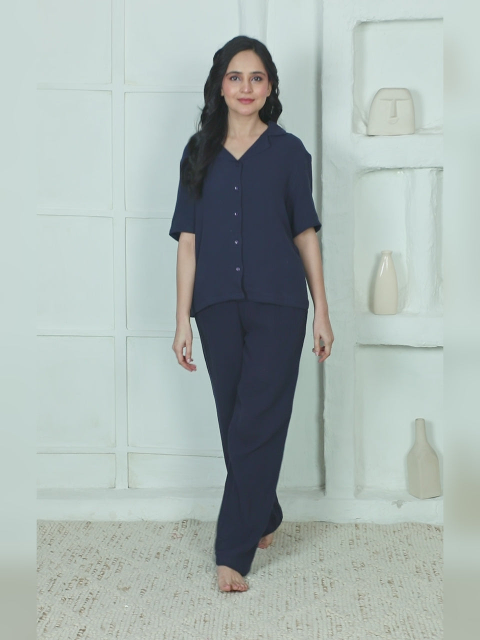 Explore the stylish women’s navy blue night suit featuring a soft viscose button-down top and relaxed pajama pants. Comfortable sleepwear perfect for lounging and night comfort.