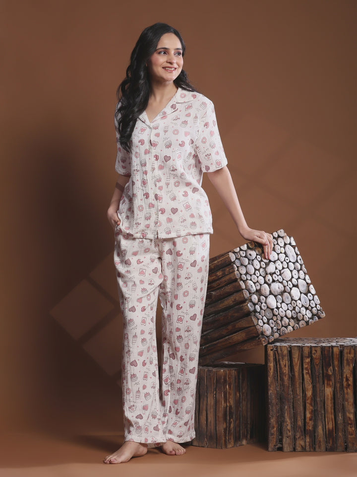 Watch the stylish women’s off-white printed night suit made from soft viscose fabric. Button-down pajama set designed for breathable comfort and elegant sleepwear.